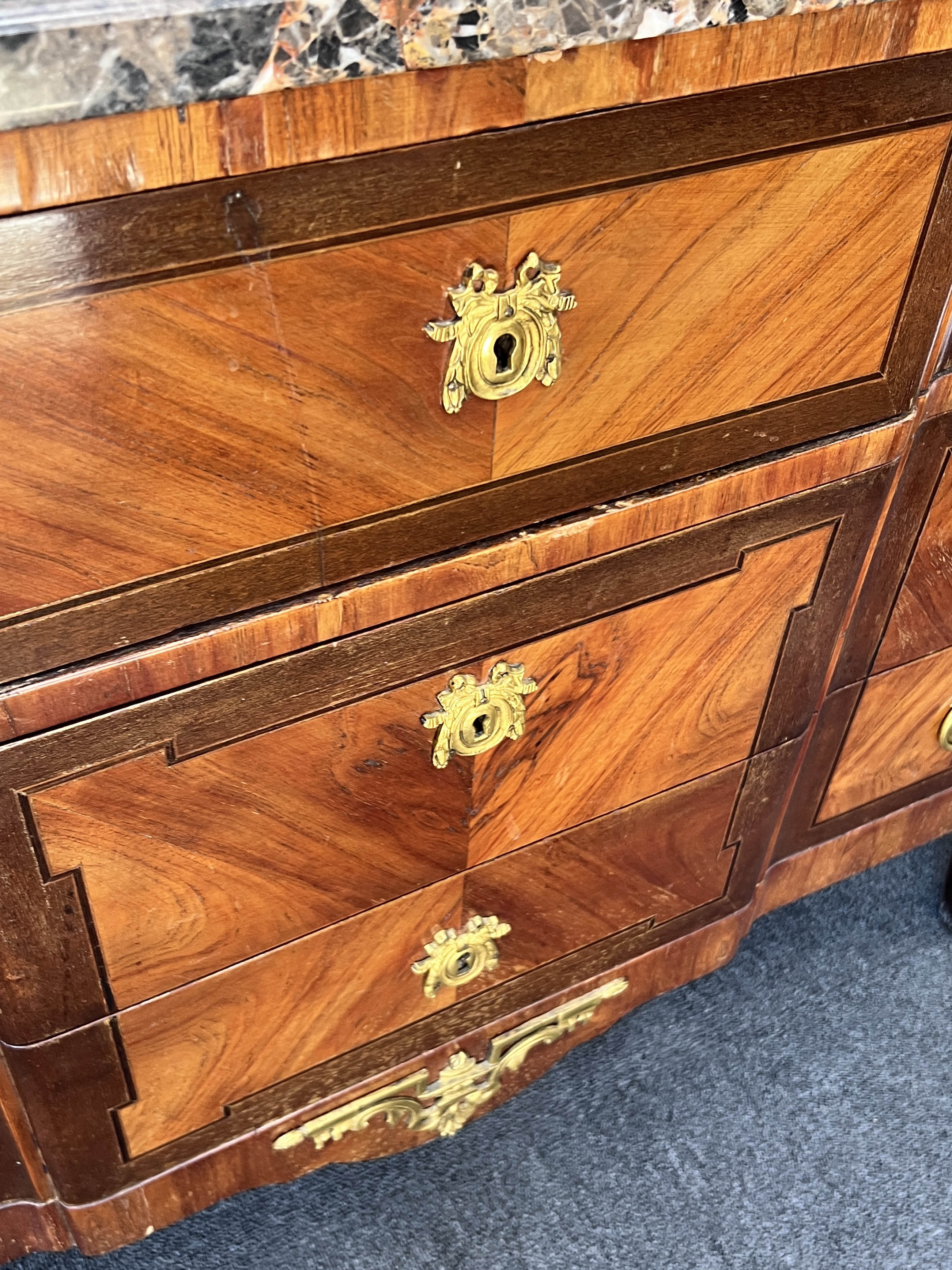 A French transitional style gilt metal mounted marble top kingwood commode, width 118cm, depth 52cm, height 85cm